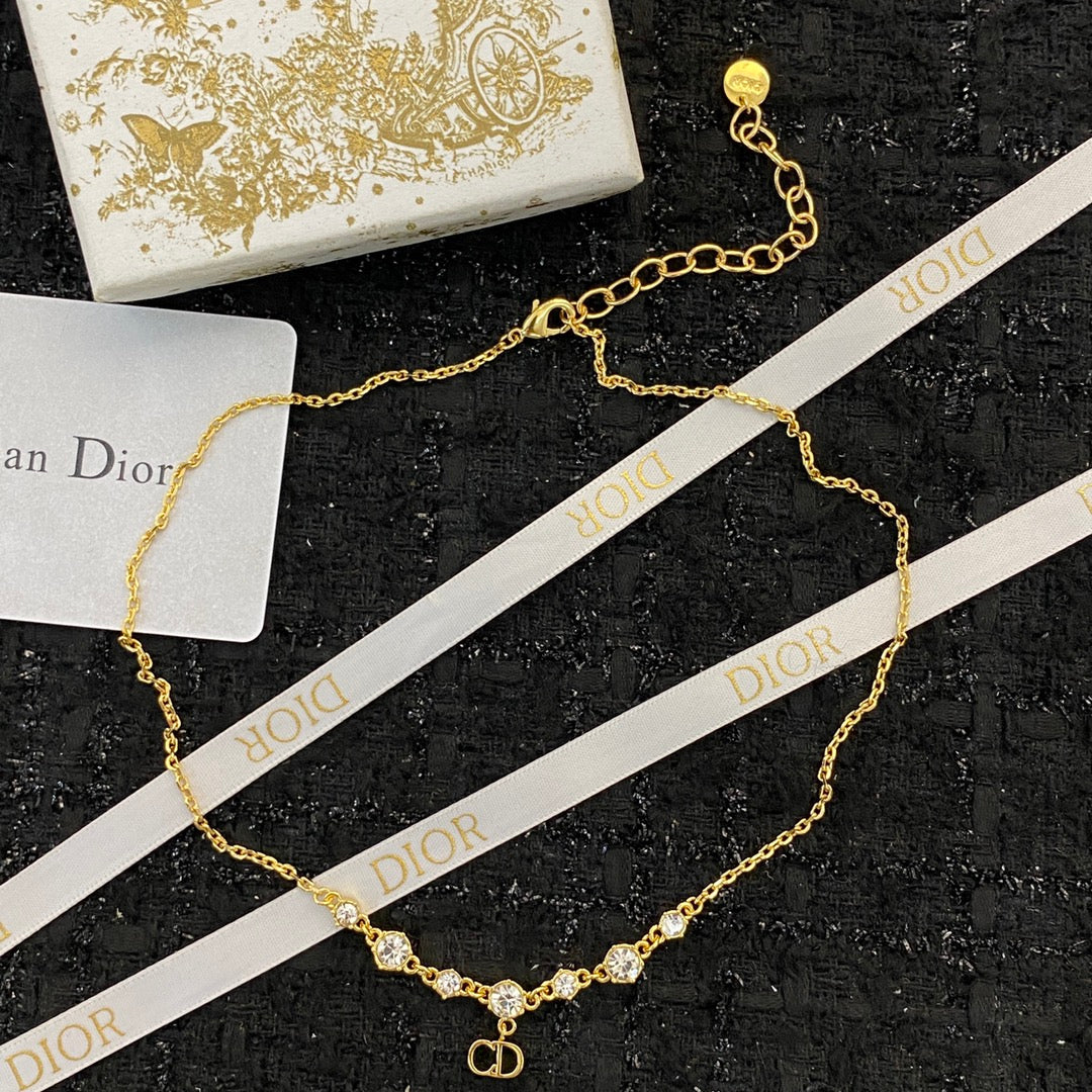 CD 26S CD Logo CZ Station Necklace In Gold Tone Metal 631851
