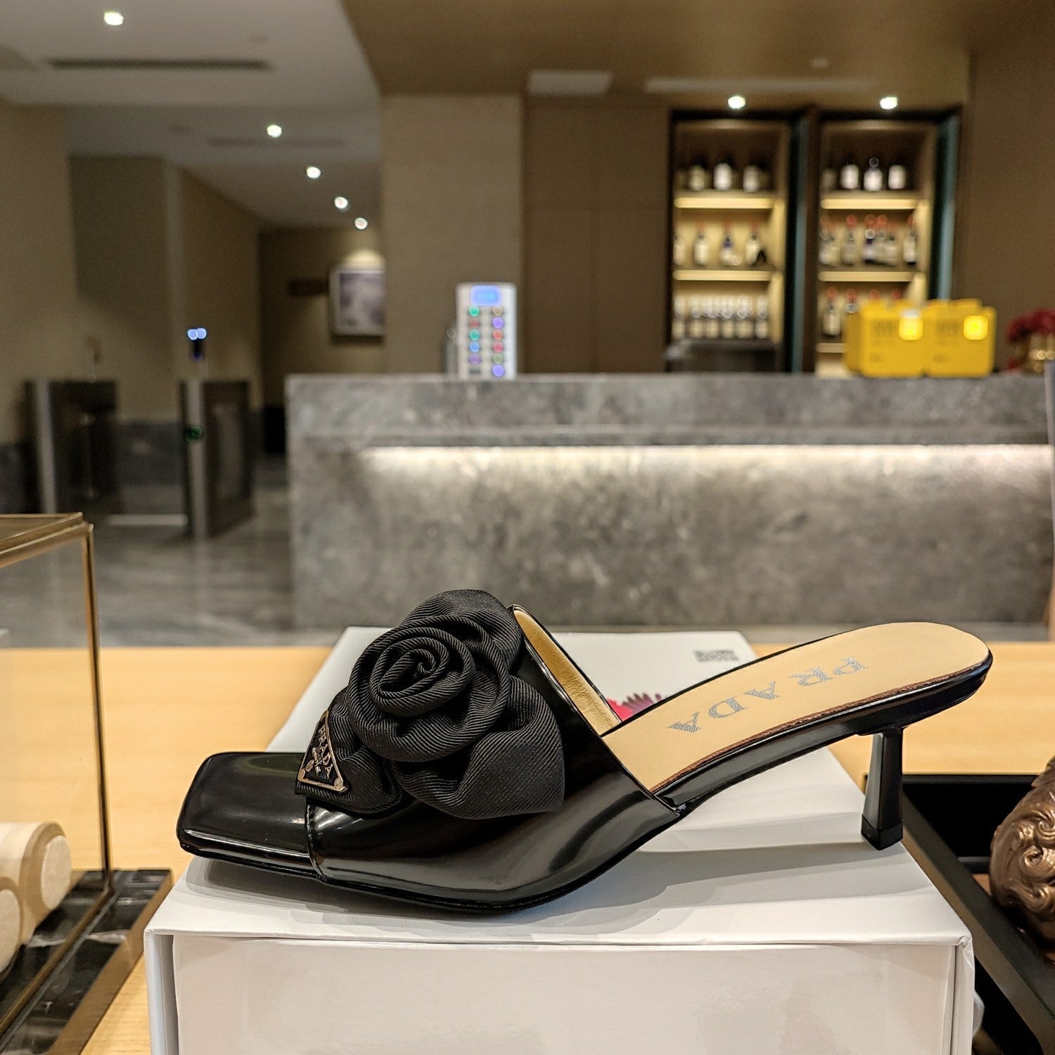 Prada 26s Open Toe Mules 45mm In Black Patent Calfskin With Rosette