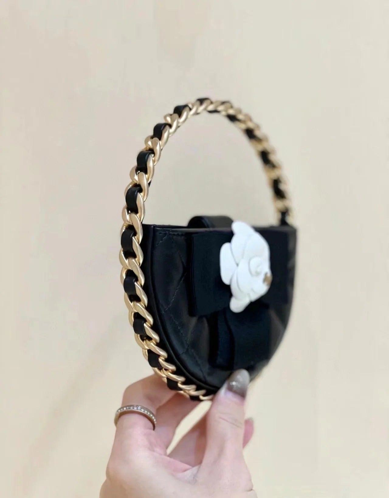 Chanel 2026 Quilted Round Camellia Mini Clutch 16cm Lambskin