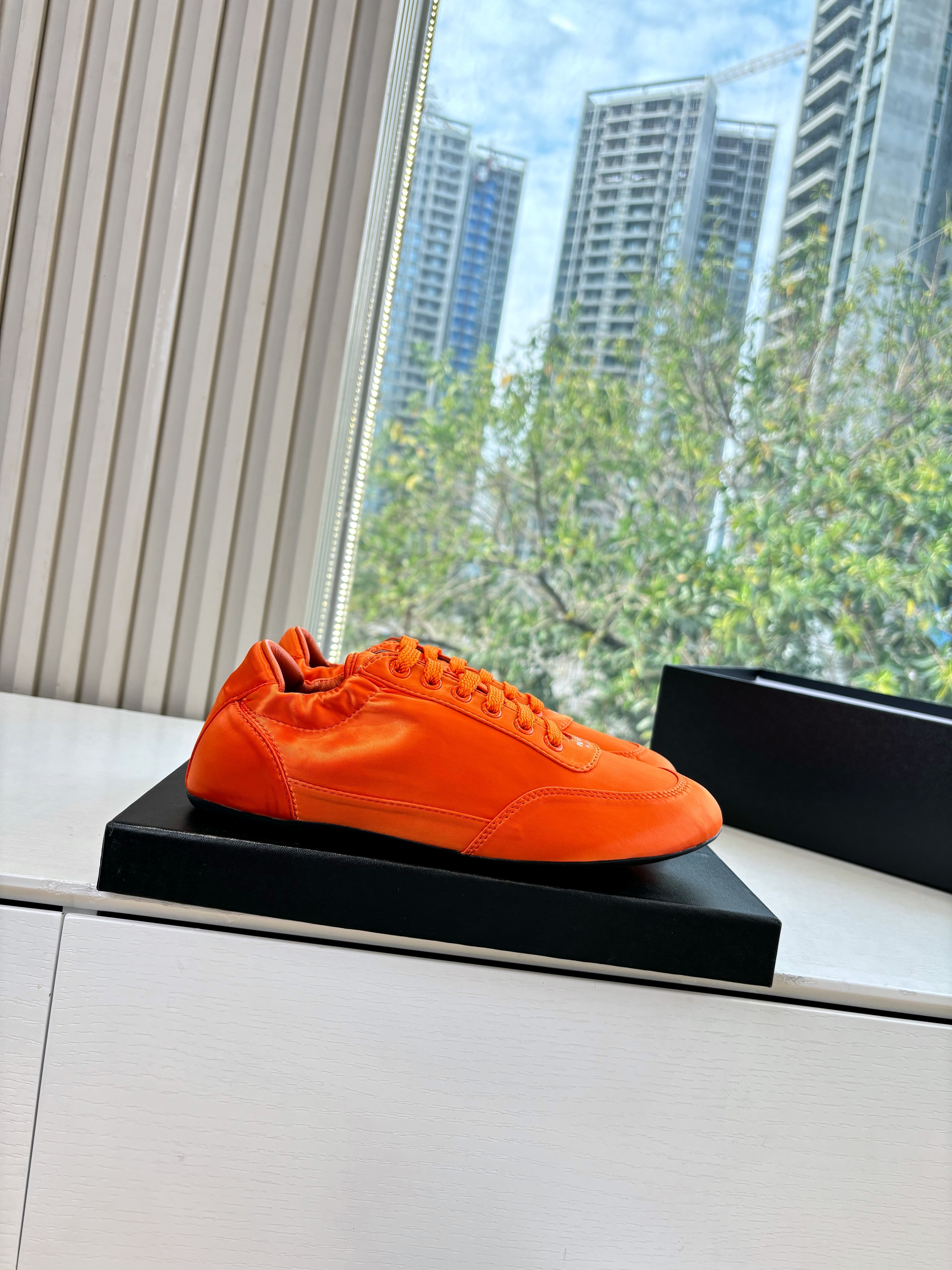 Prada 25s Sneaker In Orange Silk