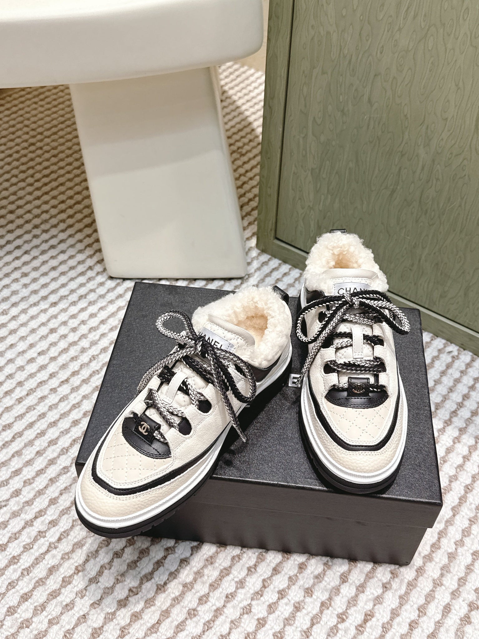 Chanel 26s Thick-Sole Sneakers In White And Black Calfskin With Fur Lining