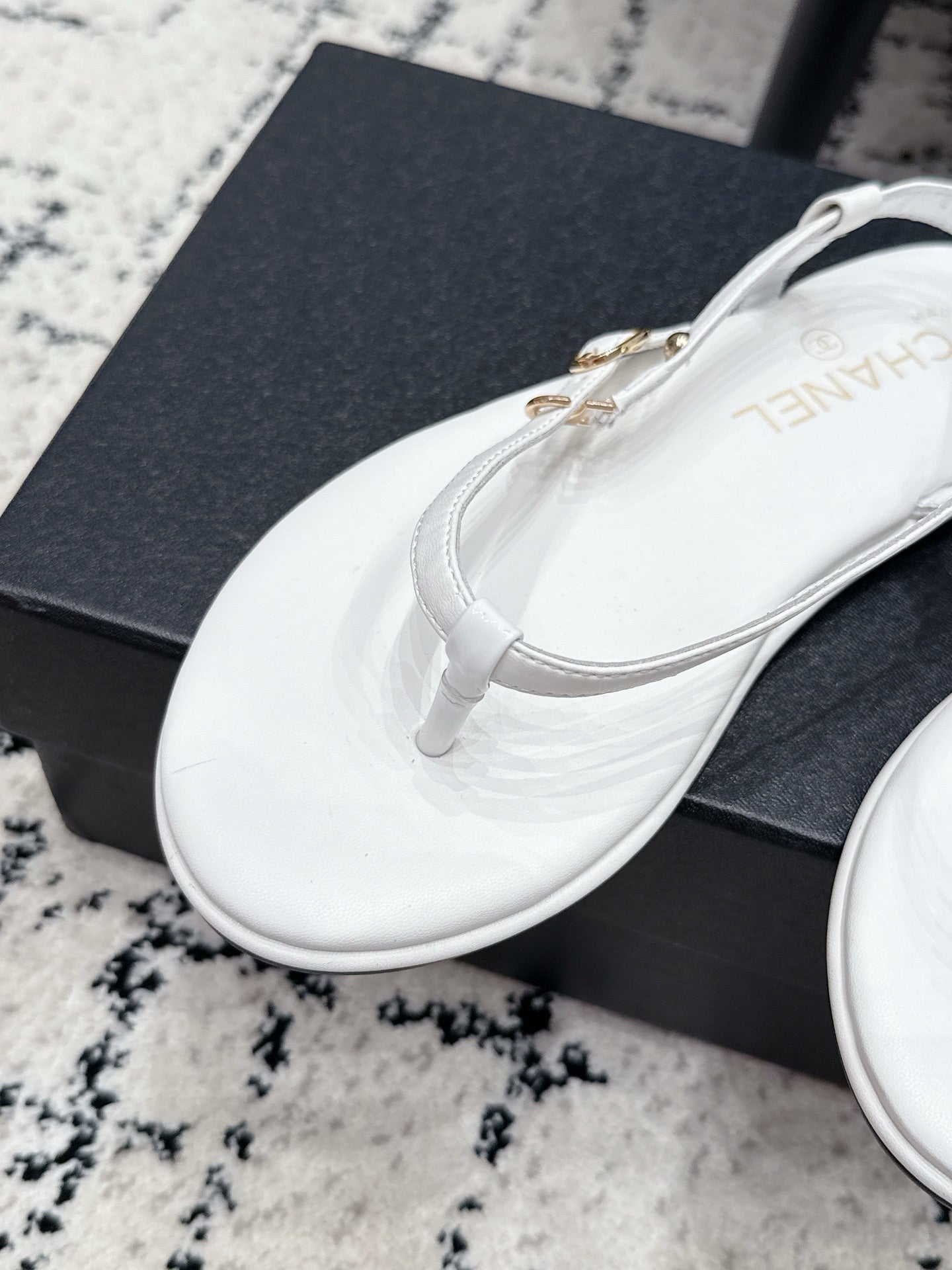 Chanel 26S Thong Sandals In White Calfskin With Gold Hardware