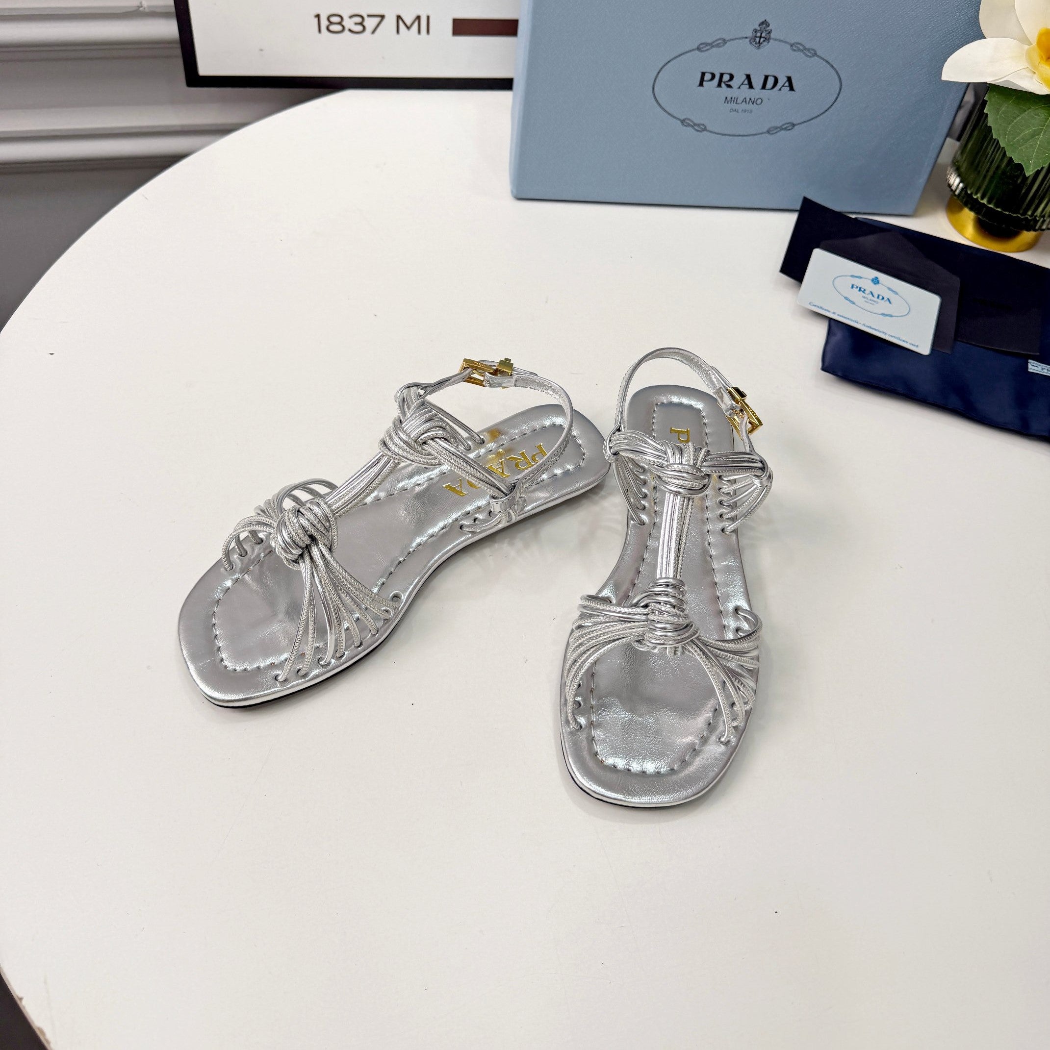 Prada 26s Knotted Metallic Leather Flat Sandals Sliver Metalic Leather 986577