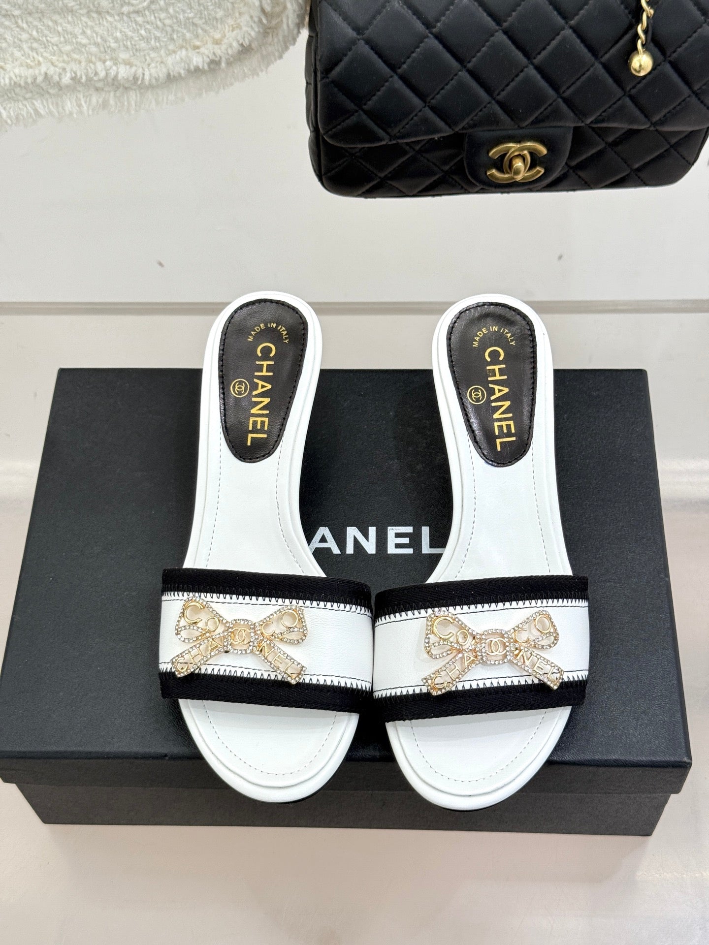 CC Classic Rhinestone Bow Kitty Slippers Black White Sheepskin 643092