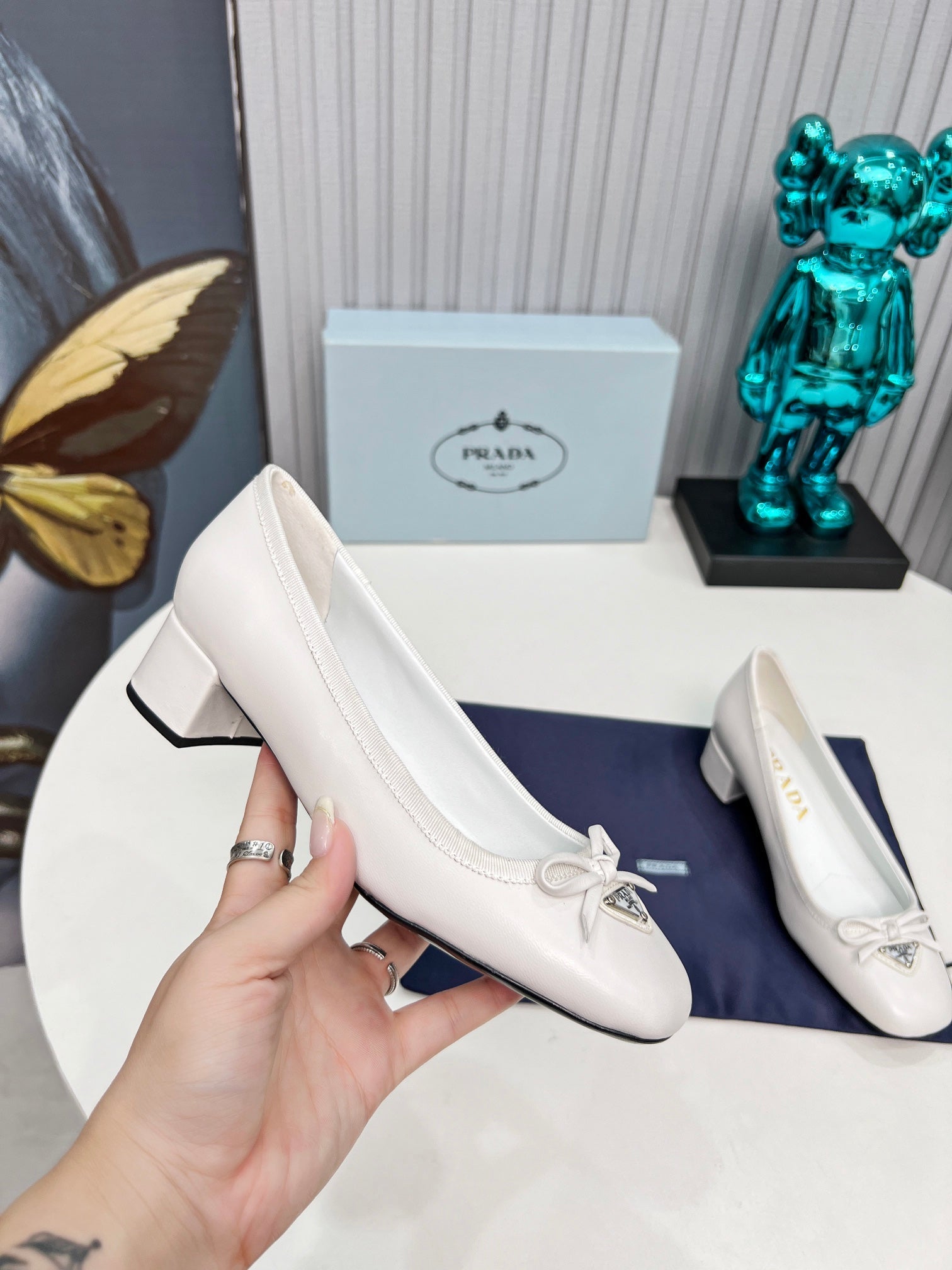 Prada 26s Round Toe Pumps Block Heel 40mm In White Calfskin With Bow