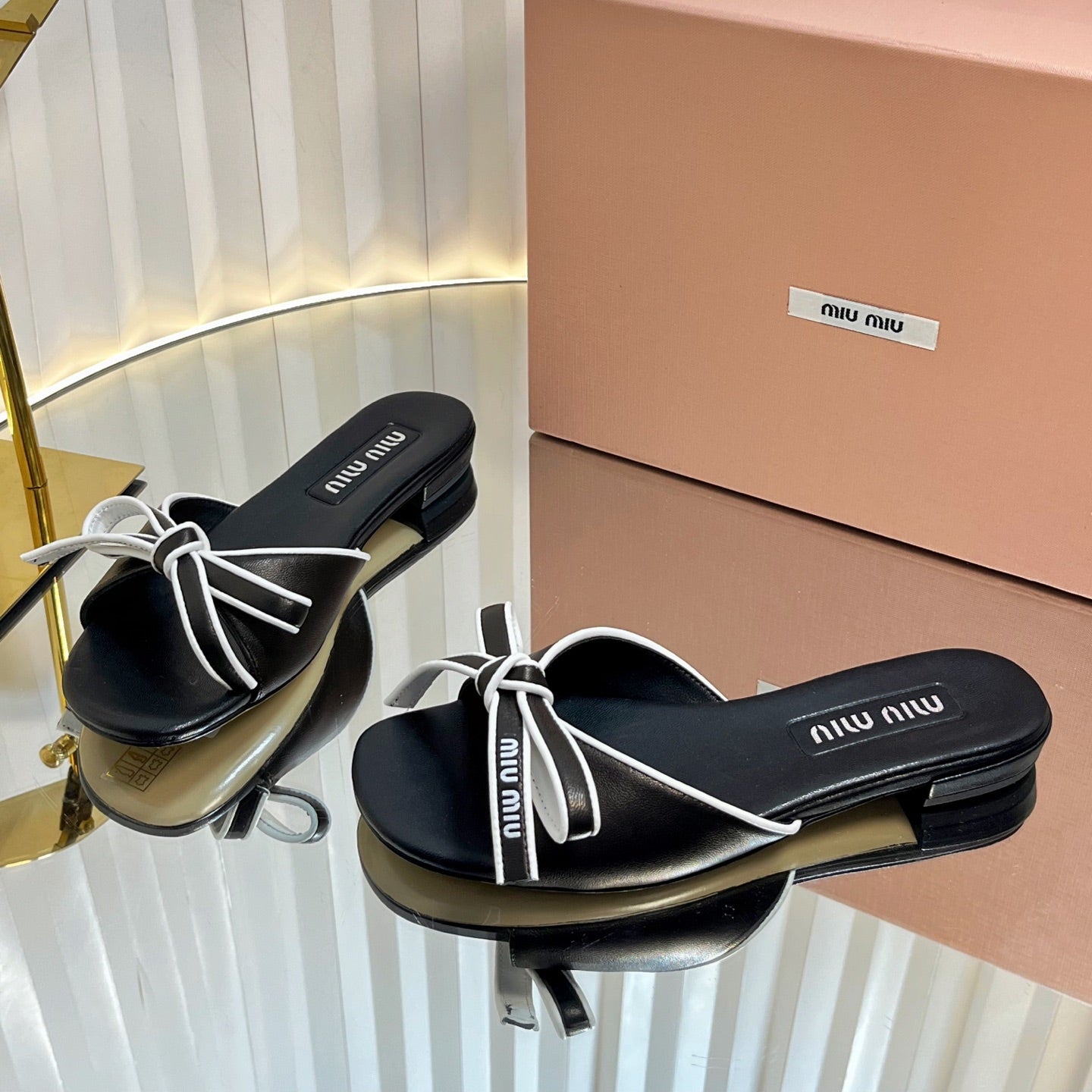 Miu Slides Sandals In Black With White Border Calfskin Bow In Trap