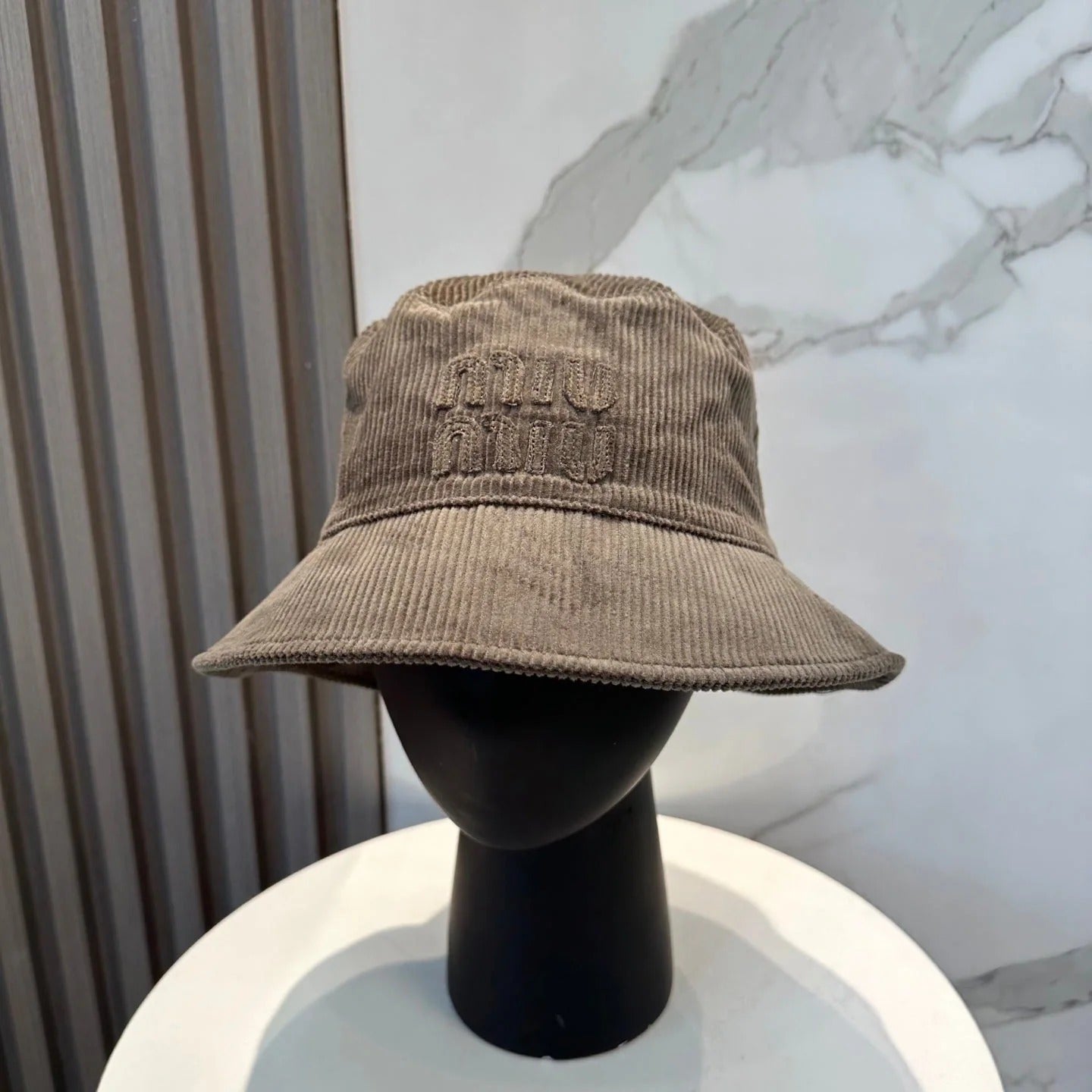 MM BUCKET IN MUTED BROWN VELVET WITH LOGO