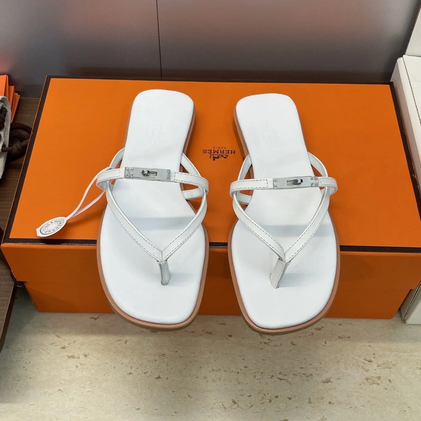 HM 26ss Kelly Sliver Buckle Slipper White Calfskin 607159