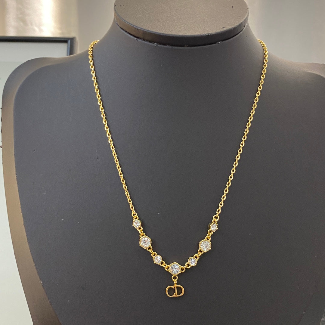 CD 26S CD Logo CZ Station Necklace In Gold Tone Metal 631851