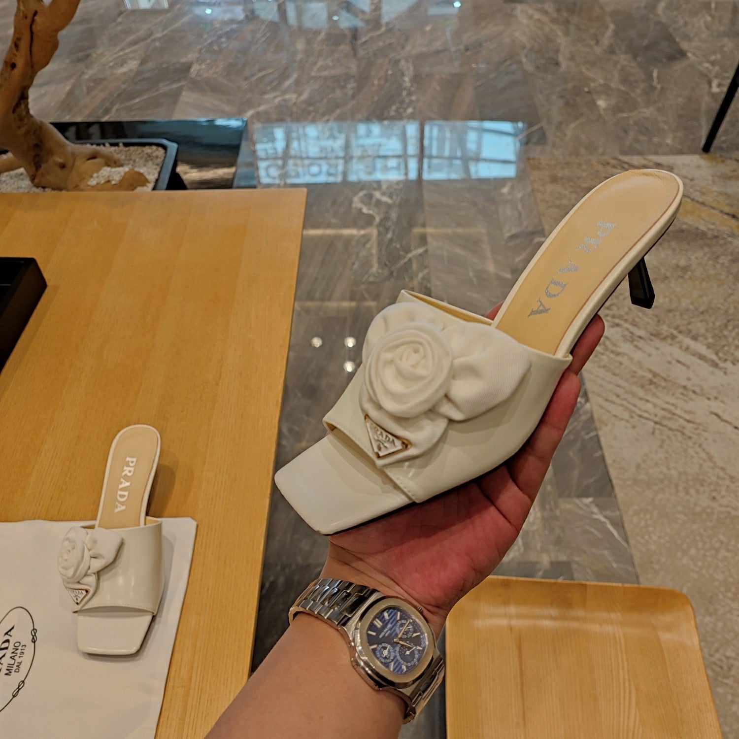 Prada 26s Open Toe Mules 45mm In White Patent Calfskin With Rosette