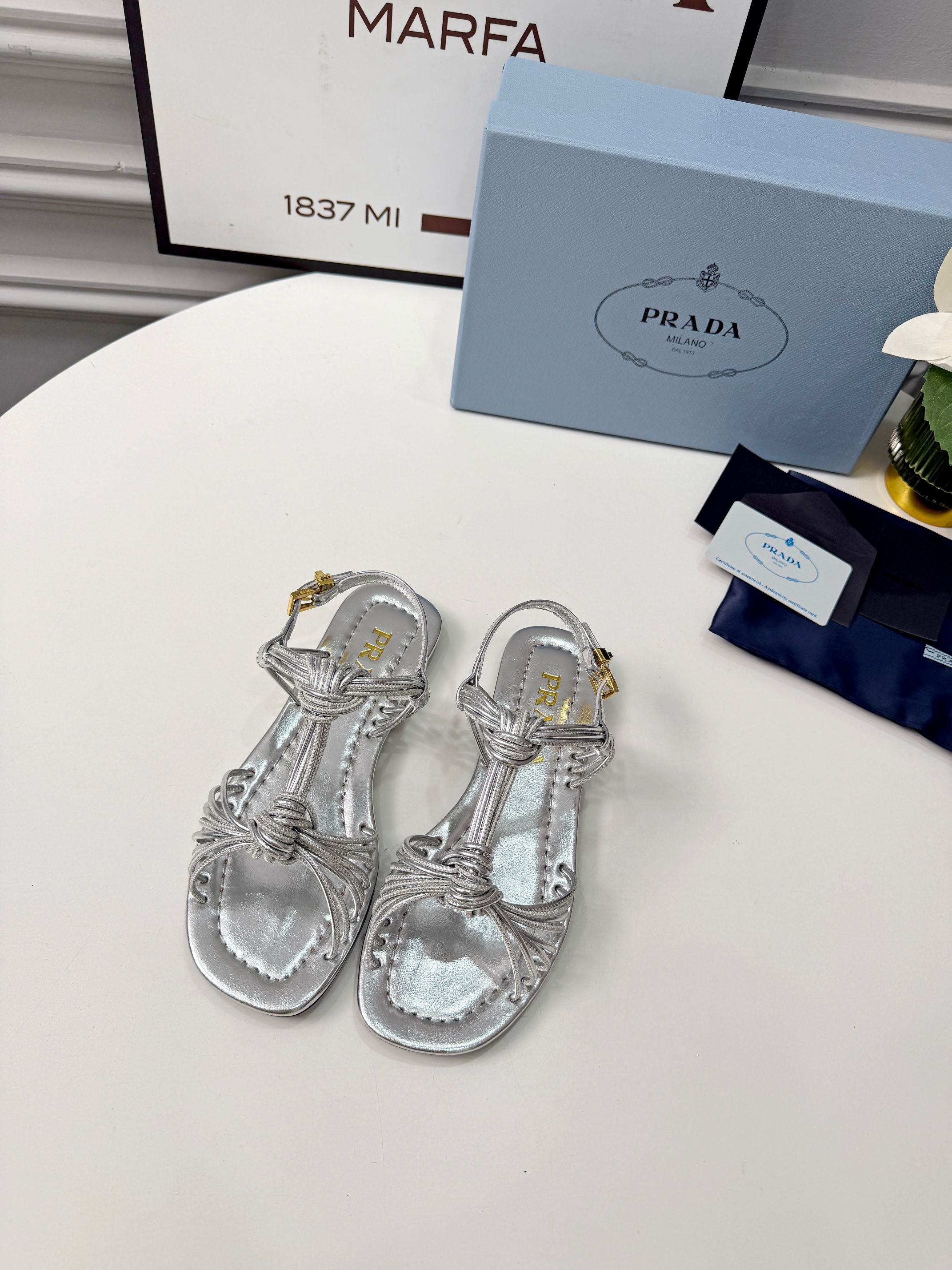 Prada 26s Knotted Metallic Leather Flat Sandals Sliver Metalic Leather 986577