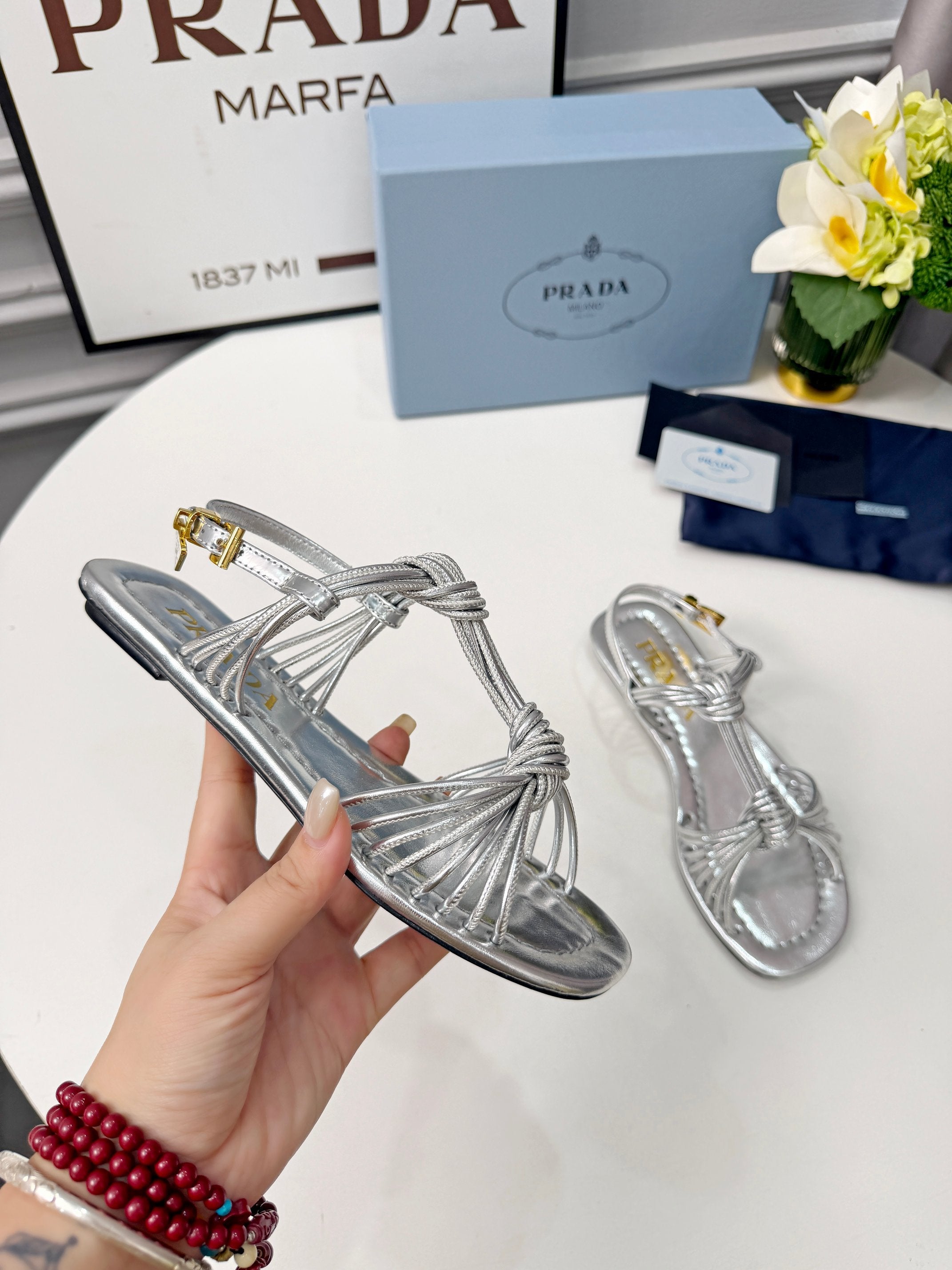 Prada 26s Knotted Metallic Leather Flat Sandals Sliver Metalic Leather 986577