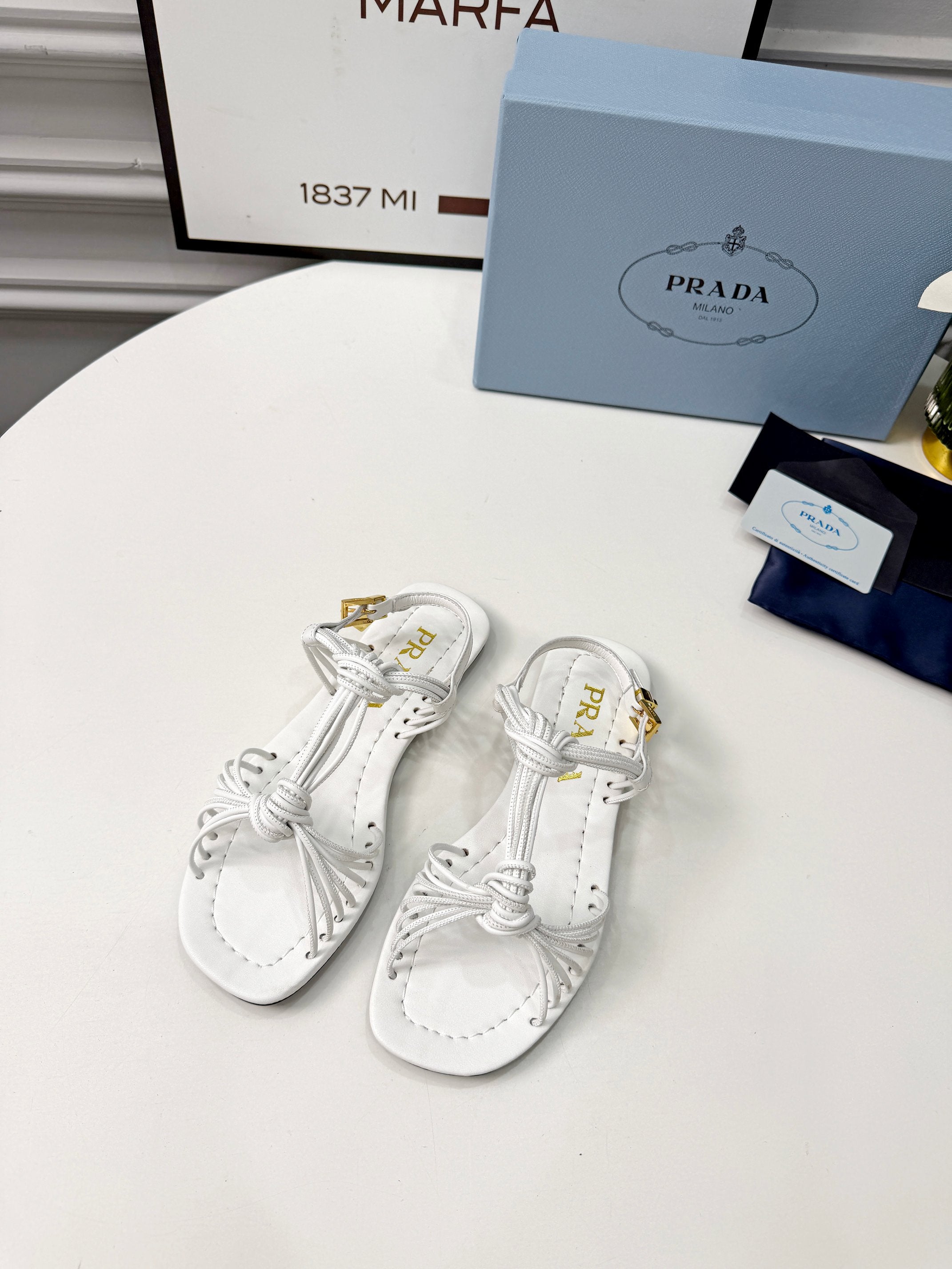 Prada 26s Knotted Metallic Leather Flat Sandals White Leather 986576