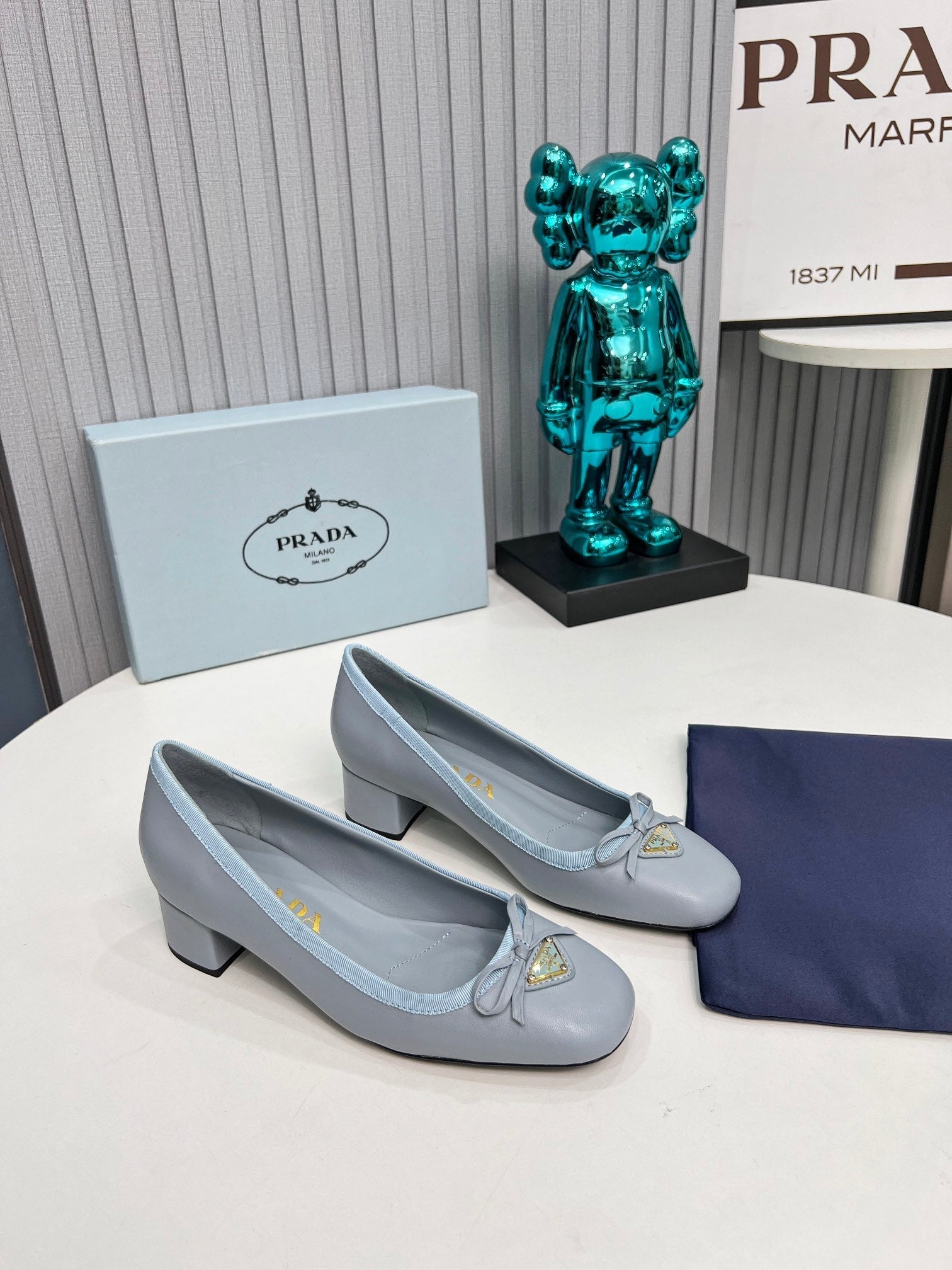 Prada 26s Round Toe Pumps Block Heel 40mm In Light Blue Calfskin With Bow