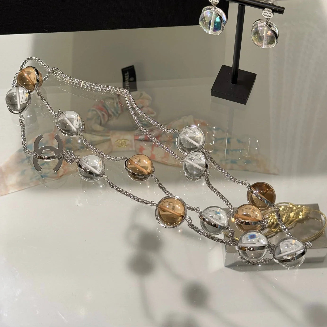 Chanel 2026 Transparent Crystal Ball Planet Silver Double C Long Necklace